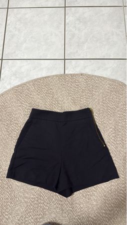 Stylish Black Shorts with Gold Zipper Detail - Size XS