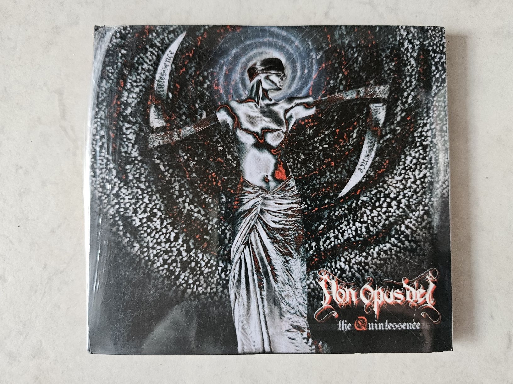CD: Non Opus Dei  -  The Quintessence  /  Fabrikneu – Nuovo e nell'imballaggio originale da Schneisingen venduto da backstore24