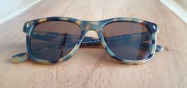 Sonnenbrille Hawkers original im Ambra Farbe gesprenkelt.