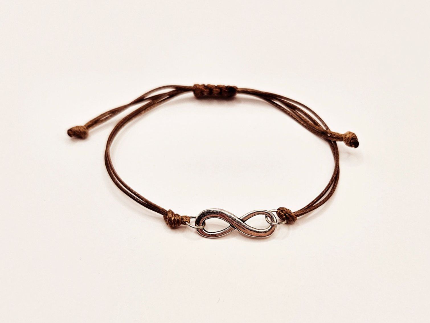Bracciali & Braccialetti: Damenarmband Makramee Braun Infinity Symbol Silber One Size – Nuovo e nell'imballaggio originale da Thalwil venduto da Seesteine 1