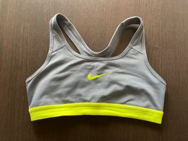 Brassière de sport Nike Dri-FIT gris/jaune fluo T.S ?...