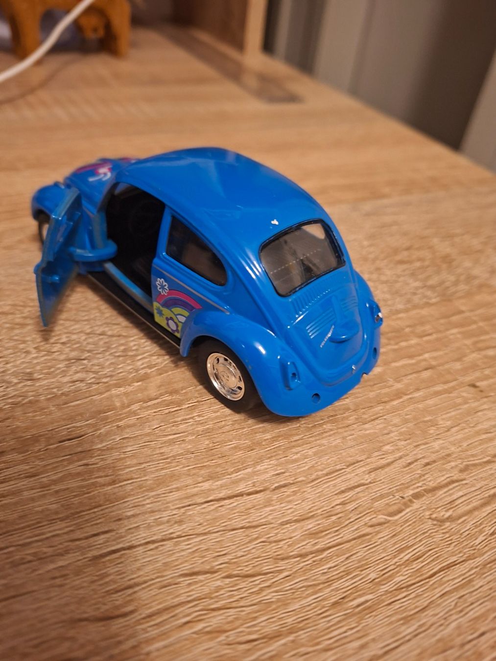 Volkswagen Modellini d'auto: VW Käfer Modellauto blau mit Blumenmuster – Usato da Ehrendingen venduto da CHMEX 2