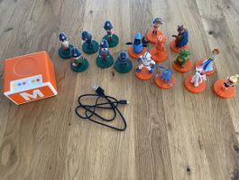 Migros Mania Box mit vielen Figuren und Ladekabel
