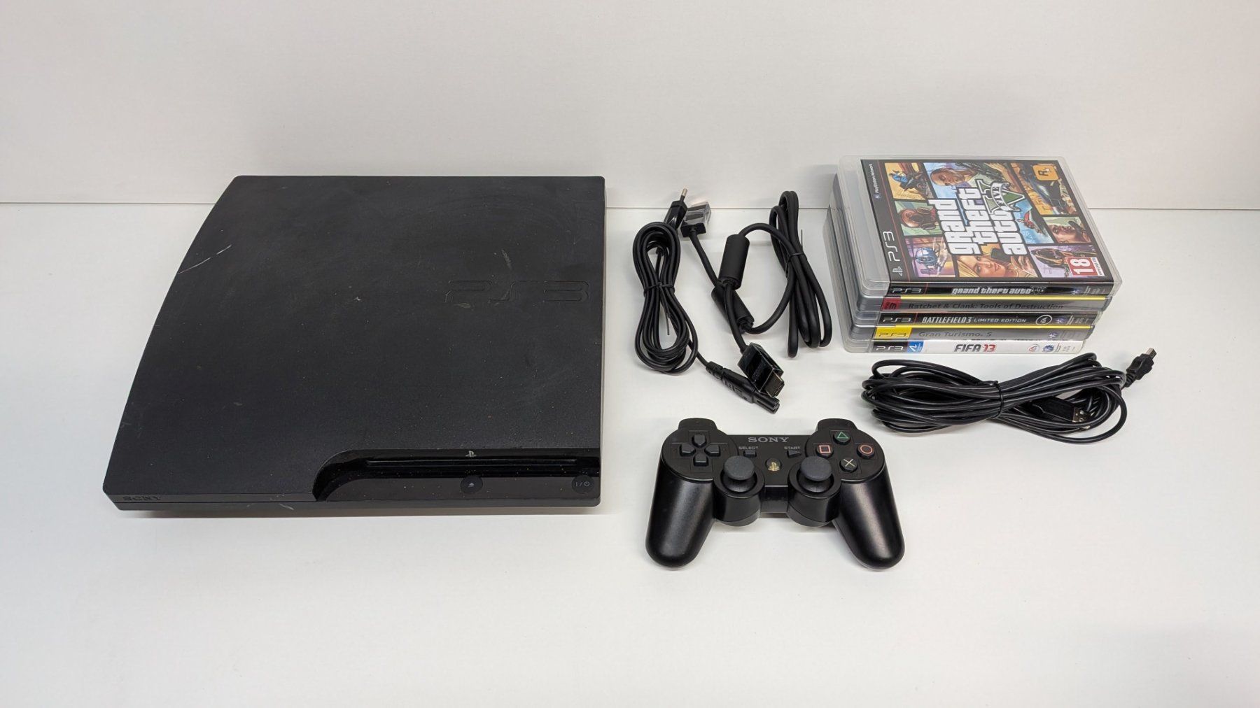 Sony Consoles: Sony PlayStation 3 mit Controller und 5 Games – D'occasion à Menziken par mame18