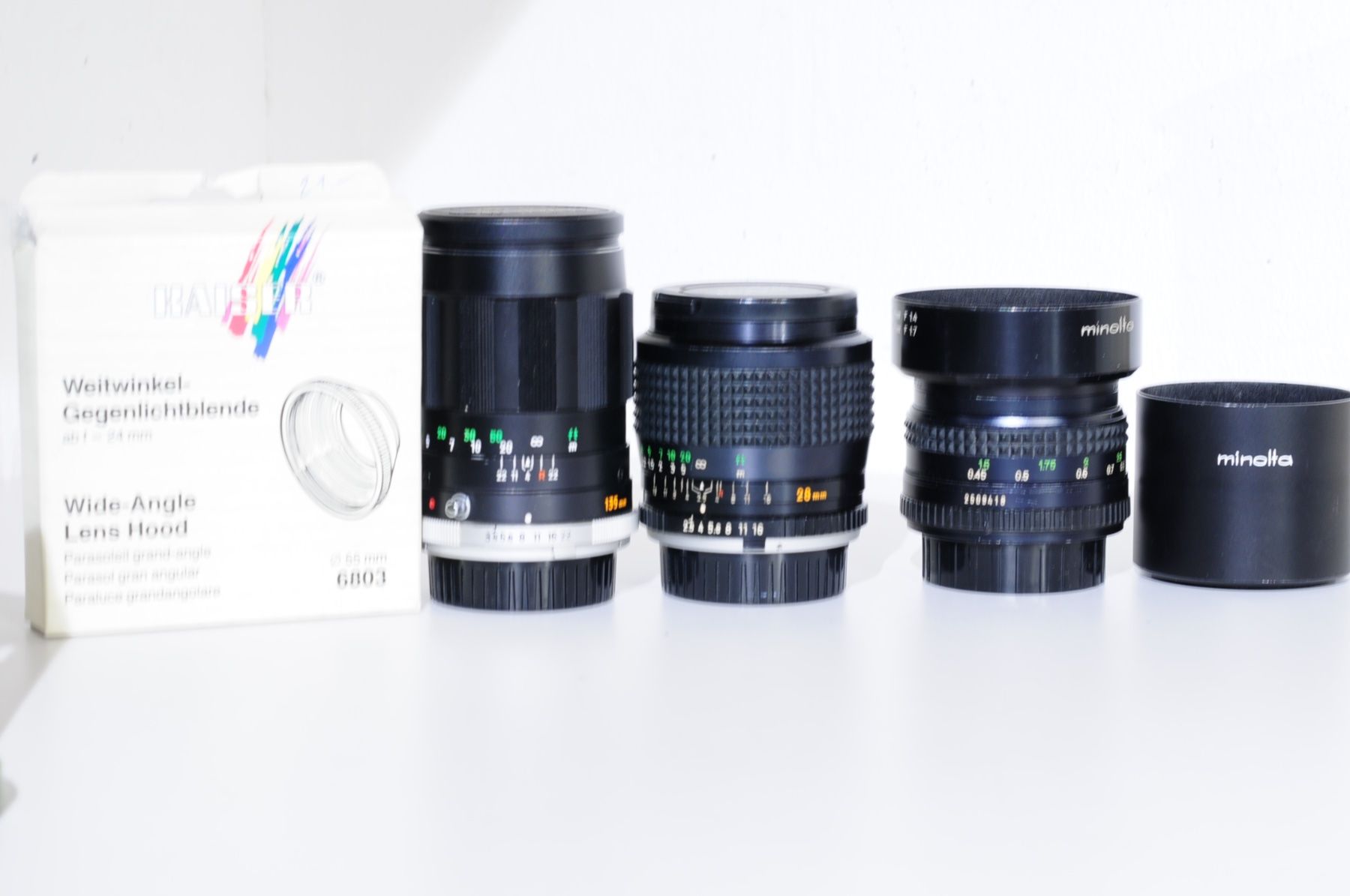 Minolta Obiettivi: 3 Minolta Objektive MC, MD Rokkor top Zustand – Usato da Rheinfelden venduto da Fotomechaniker-AD 4