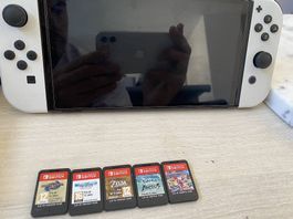 Nintendo switch oled avec jeux et accessoires