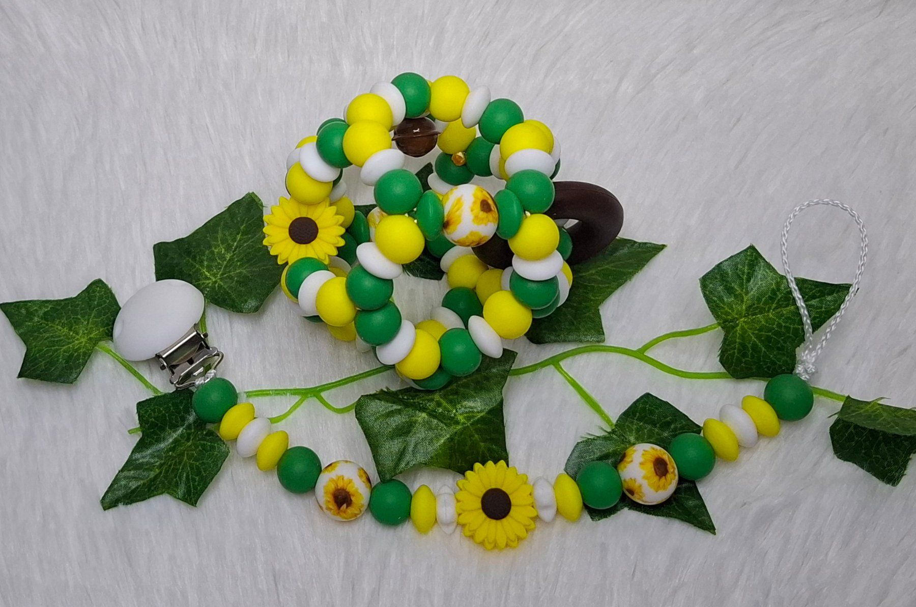 Succhiotti & catenelle porta ciuccio: Set Nuggiketteli + Motorikball Löwe oder Blume – Nuovo e nell'imballaggio originale da Oberurnen venduto da rotty80 2