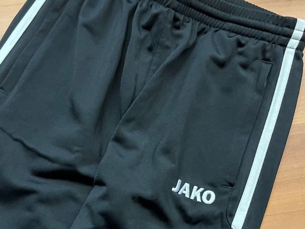 Jako-O Completi: JAKO Junioren Trainer, rot/schwarz,  Grösse128 – Nuovo e nell'imballaggio originale da Adliswil venduto da vette56 3