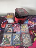 Lotto carte Pokémon con scatola di metallo in omaggio