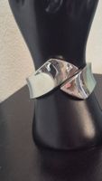 Bracciale rigido effetto argento design moderno