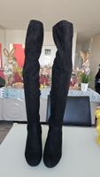 Bottes haut tres stylé daim noire avec talon métallique