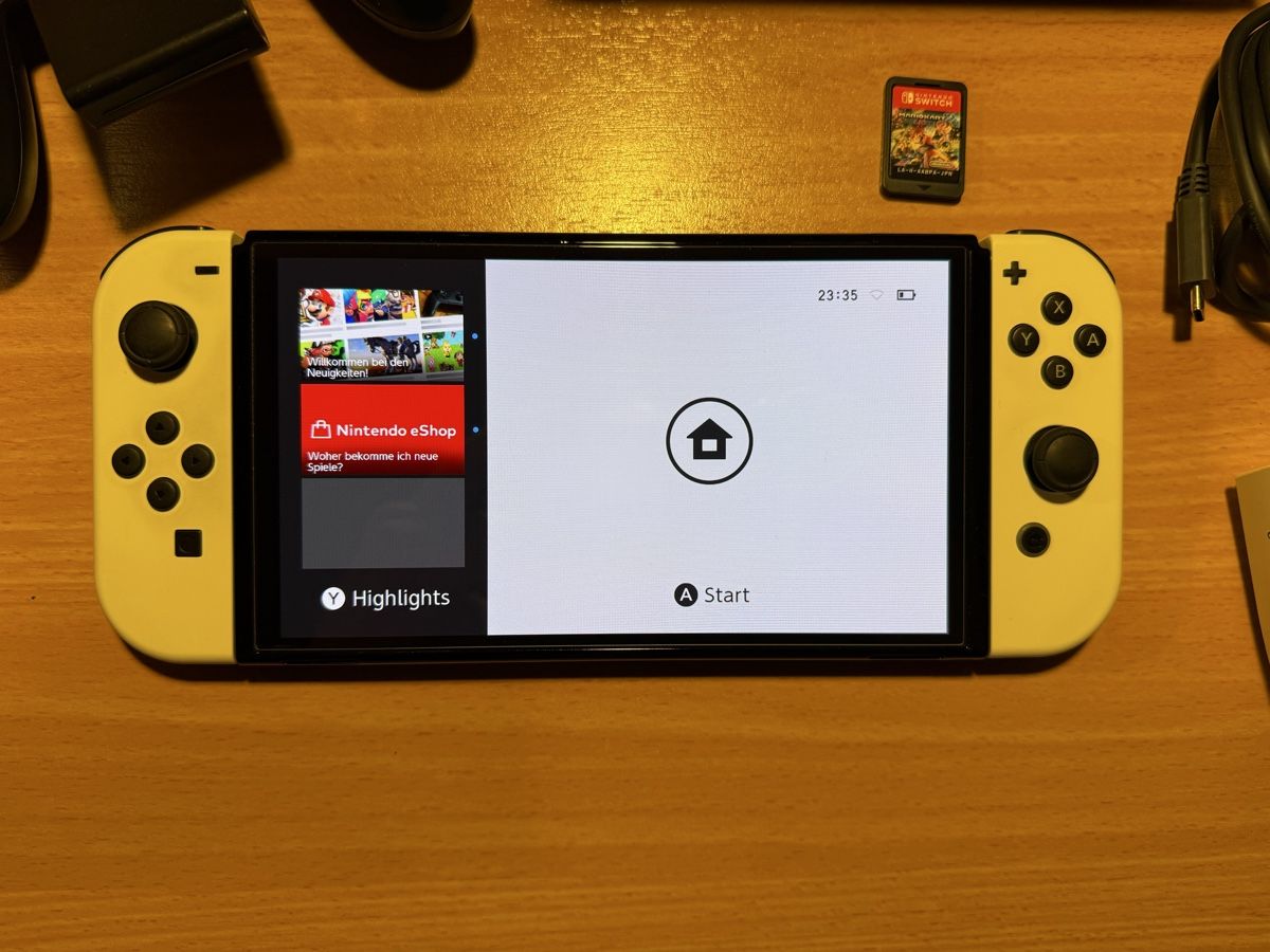 Nintendo Konsolen: Nintendo Switch OLED Ananas Edition mit Mario Kart – Gebraucht aus Dierikon von E28_Freak 1