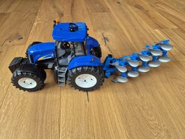 New Holland Traktor mit Pflug Spielzeug