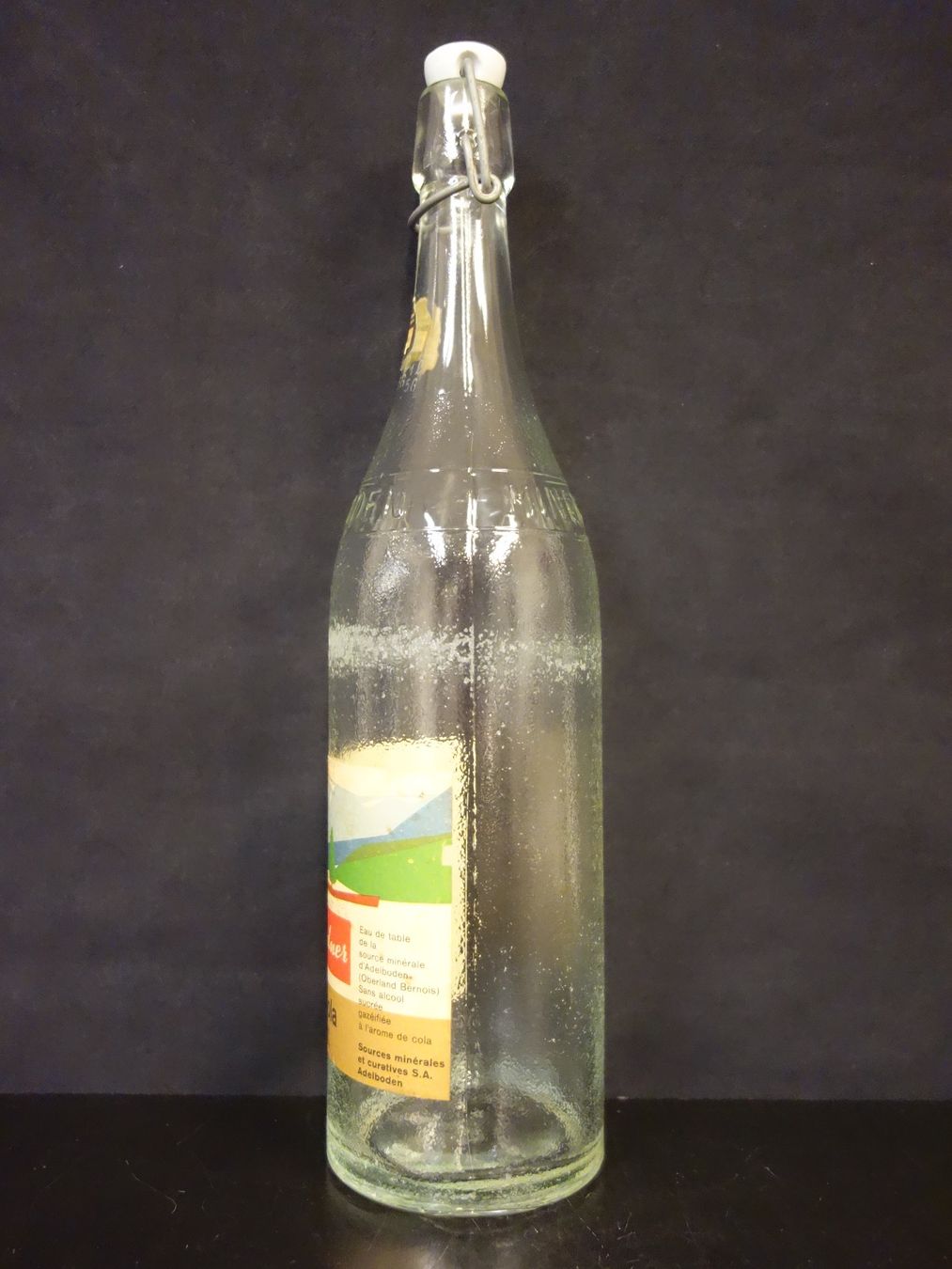 Bicchieri, Caraffe & Bottiglie: alte Flasche ADELBODNER ADEL - COLA 1965 – Usato da Kerzers venduto da Flaschenposten 1