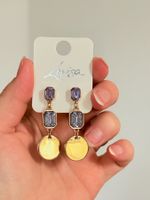 Boucles d'oreilles Lovisa dorées avec pierres violettes