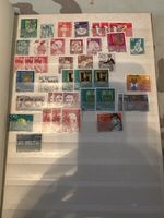 Briefmarkenalbum mit diversen Briefmarken