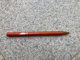 Antiker oranger Markierstift Crayon Gommeux