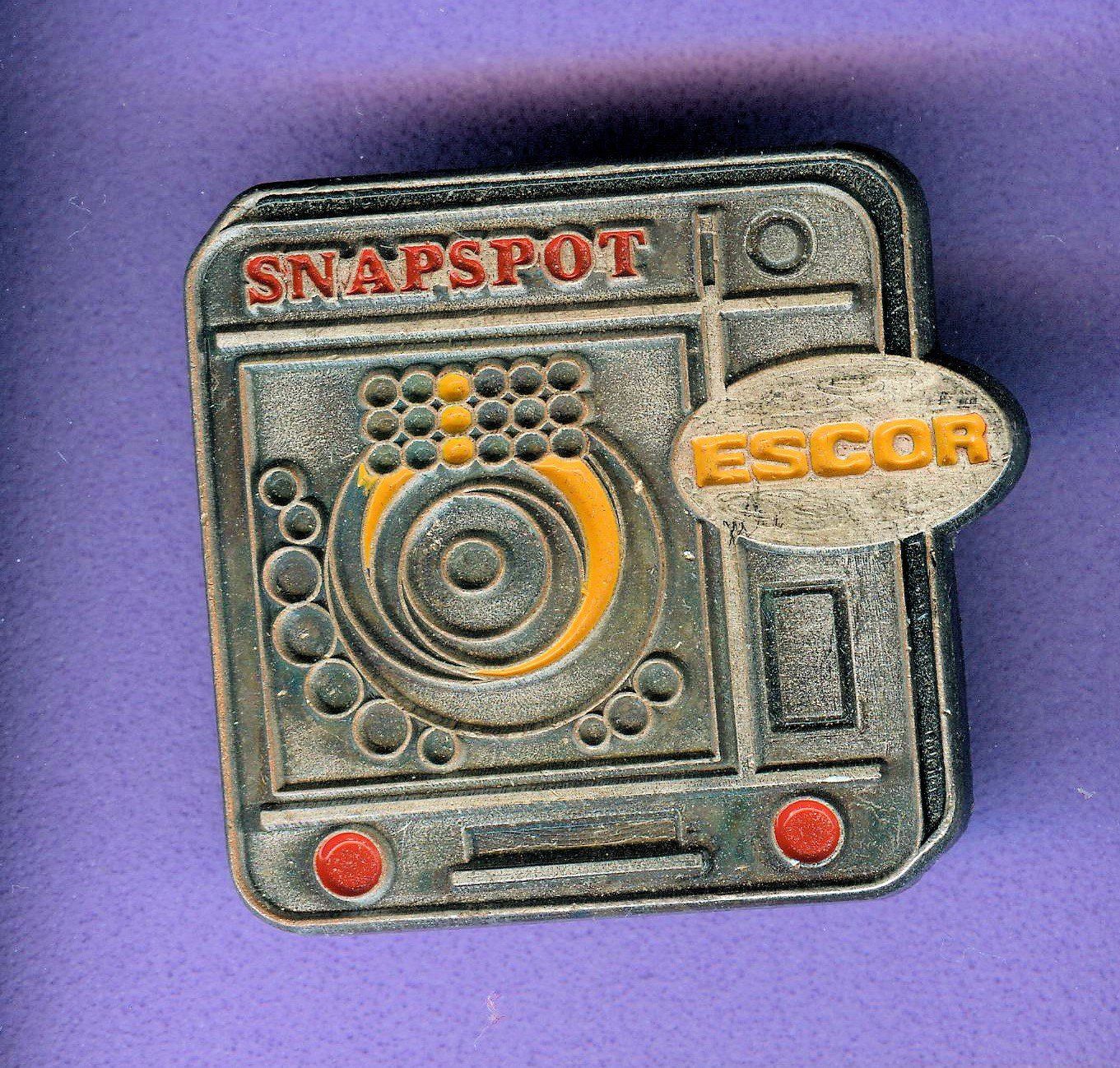 Placchette & Badge: SNAPSPOT  orange= 2 fach – Usato da Winterthur venduto da Sammleroase