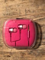 Écouteurs intra-auriculaires roses en parfait état.
