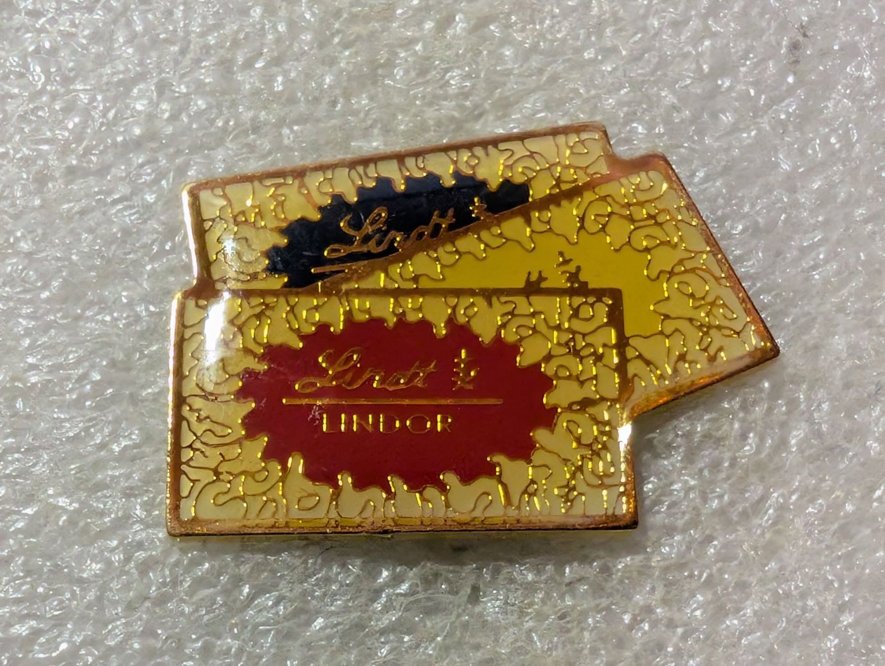 Placchette & Badge: Ansteckpin 140: Lindt – Usato da Oppligen venduto da Pin-Fall-Shop