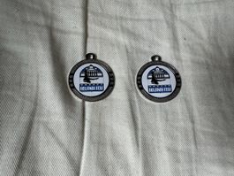 2 gleiche silberne Medaillen