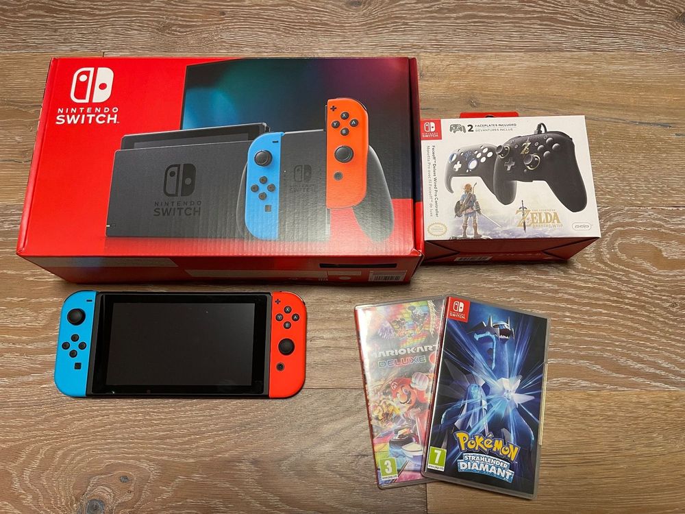 Nintendo Switch Neon + Spiele + Zubehör Kaufen auf Ricardo