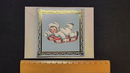 Weihnachts-Karte SNOWBALL KIDS auf Schlitten liegend