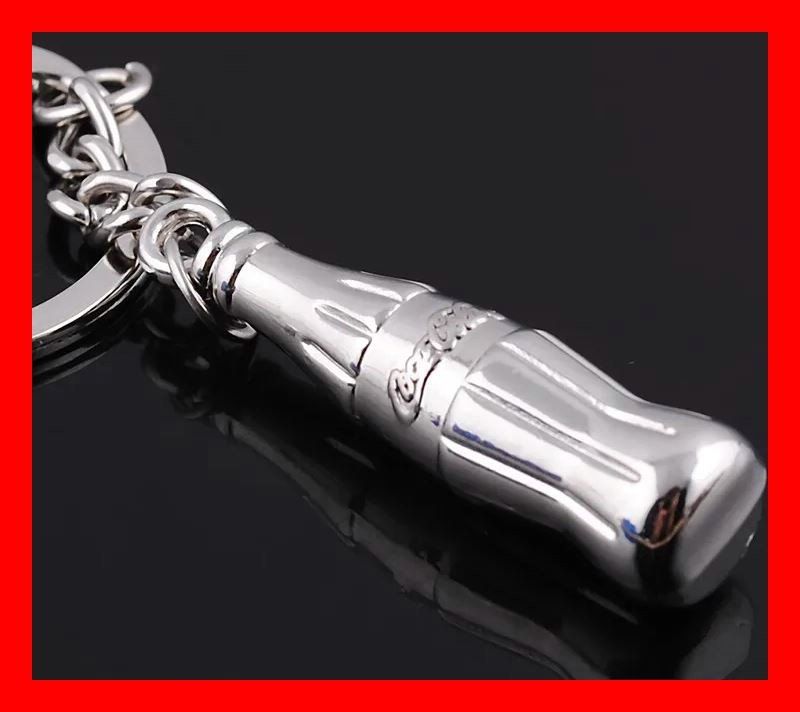 Coca-Cola Schlüsselanhänger & - bänder: Coca Cola Schlüsselanhänger Metall Zero Light Flasche Bottle – Neu und originalverpackt aus Dättlikon von easythings
