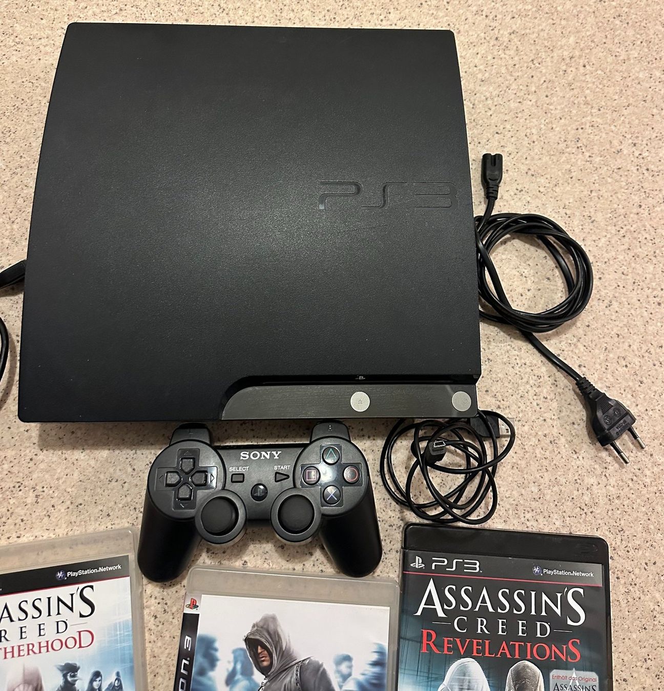 Sony Konsolen: Playstation 3 mit 3 Games und Controller – Gebraucht aus Nidau von EXP40 1