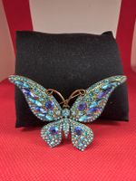 Brosche Schmetterling mit blauen Steinen goldfarben