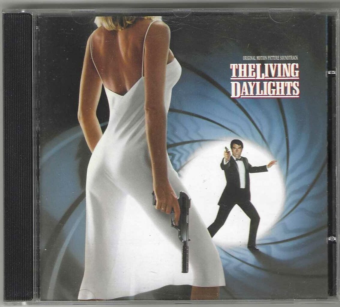 CD: John Barry - The Living Daylights James Bond – Usato da Genève venduto da CDLPBookS
