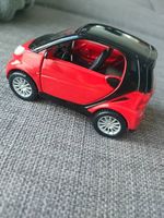 Maisto Smart Fortwo 1:32 Modellauto - rot/schwarz, Rückziehm