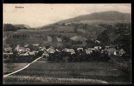 AK Stettlen, Ortsansicht mit Kirche und Feldern