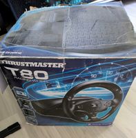 Volant thrustmaster avec support de conduite. 