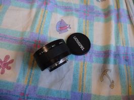 NIKON TAMRON-F AF TELE-CONVERTER 2X N-AFS MC7-DECKEL-LÄÜFT