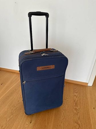 LANCEL - Valise à roulettes en toile bleu