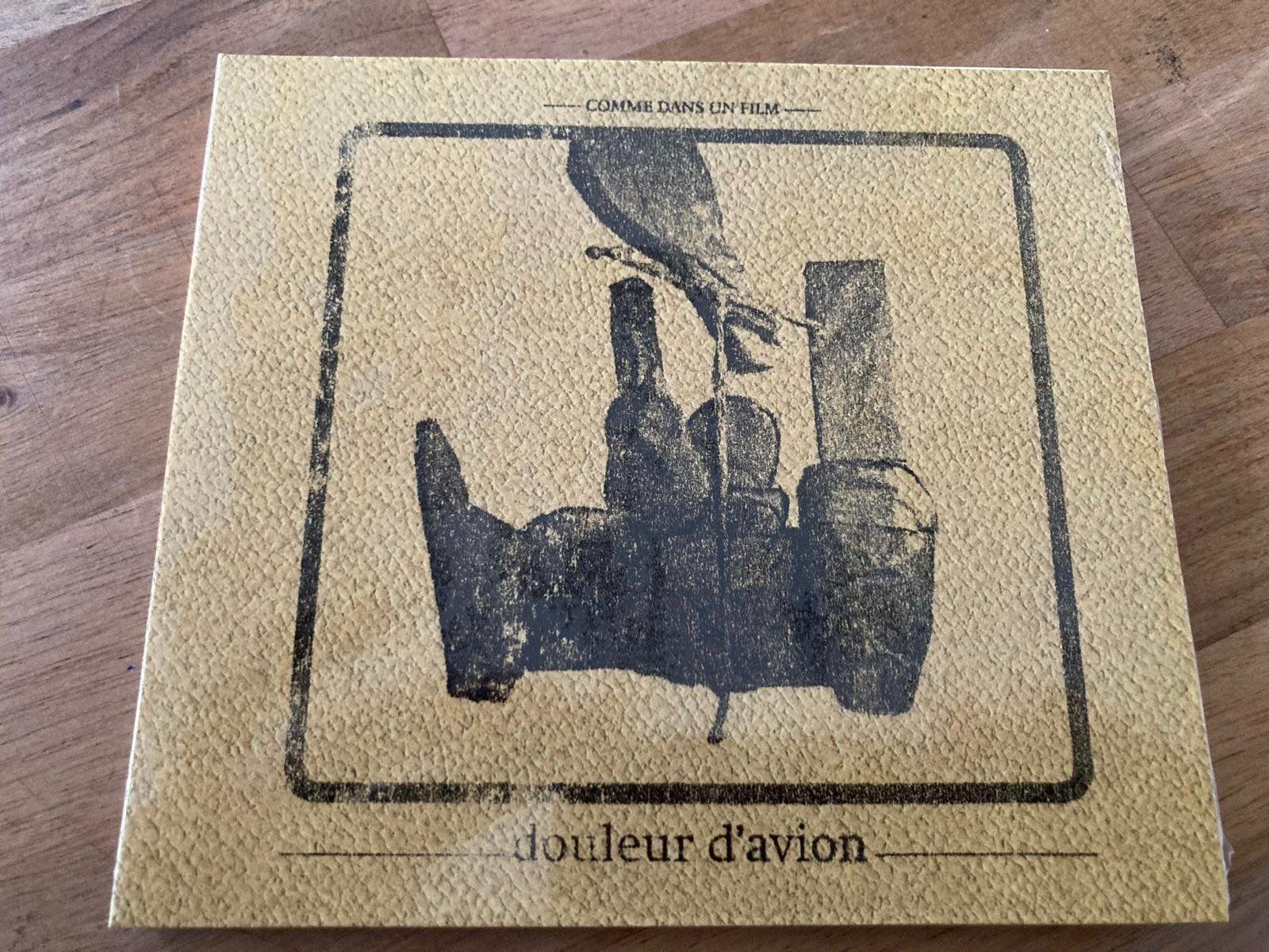 CD: DOULEUR D'AVION  "Comme dans un film" – Nuovo e nell'imballaggio originale da Biel/Bienne venduto da tal3