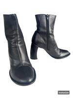Ann Demeulemeester black leather ankle boots.