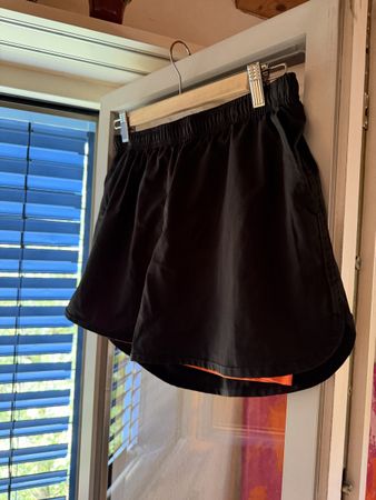 Black running shorts with orange lining size M