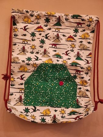 Turnsack mit Dinos und Fronttasche weiss/grün