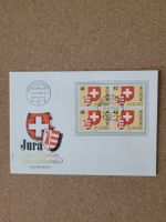 Umschlag mit 4er Block Jura Helvetia