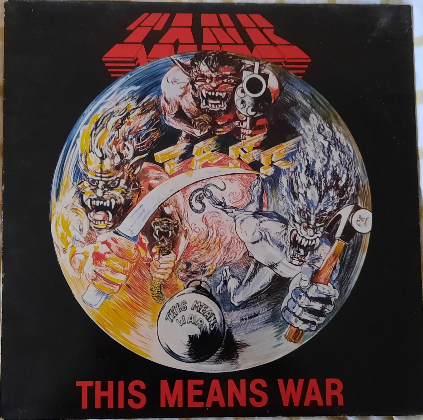 Dischi in vinile: FIRST PRESS - TANK - THIS MEANS WAR – Usato da Lausanne venduto da MHJ