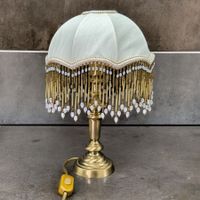 Lampe de table style Charleston bronze doré franges verre