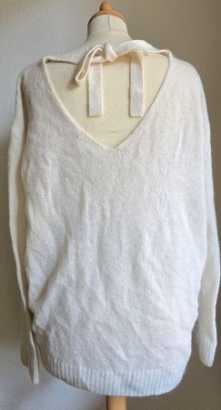 Pull H&M en laine taille XS, dos nu avec noeud couleur crème