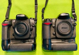 2 x Nikon D 200 inkl. 2 Batteriegriffe & 6 Akkus inkl. Lg.