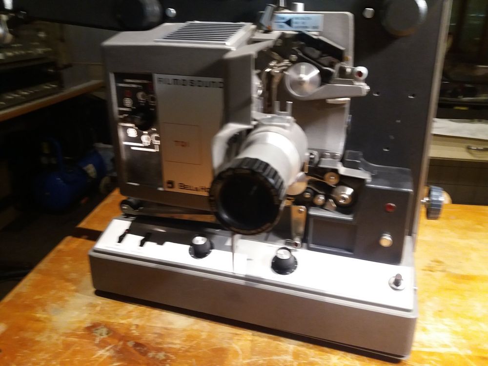 The image displays a Bell & Howell Filmosound 16mm film projector