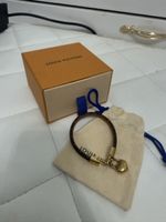 Louis Vuitton Armband mit Herz Anhänger braun Gold