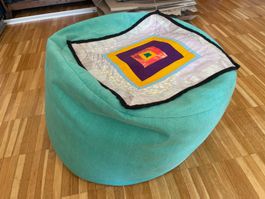 Kleiner Pouf rund türkis
