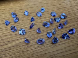 28 pc Tanzanite 28.39 ct loupe clean ab 1.-