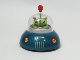 Kleines UFO mit alien, zum aufziehen, fällt nicht vom Tisch